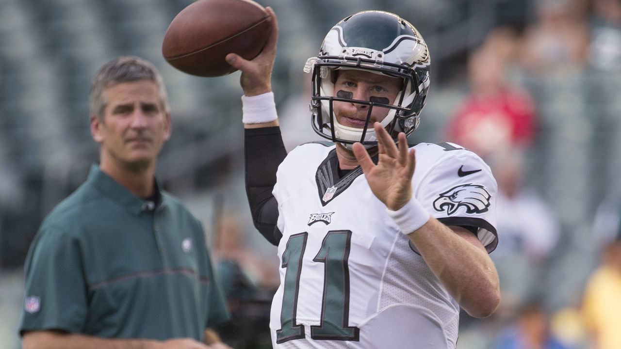 PHILADELPHIA, PA - AUGUST 11: Carson Wentz #11 of the Philadelphia Eagles warms up as offensive coordinator Frank Reich looks on prior to the game against the Tampa Bay Buccaneers at Lincoln Financial Field on August 11, 2016 in Philadelphia, Pennsylvania. The Eagles defeated the Buccaneers 17-9.