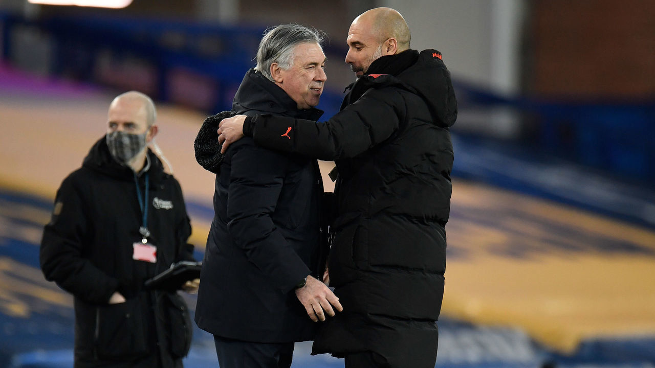 LIVERPOOL, ENGLAND - FEBRUARY 17: Pep Guardiola (R), Manager of Manchester City interacts with Carlo Ancelotti, Manager of Everton prior to the Premier League match between Everton and Manchester City at Goodison Park on February 17, 2021 in Liverpool, England. Sporting stadiums around the UK remain under strict restrictions due to the Coronavirus Pandemic as Government social distancing laws prohibit fans inside venues resulting in games being played behind closed doors.