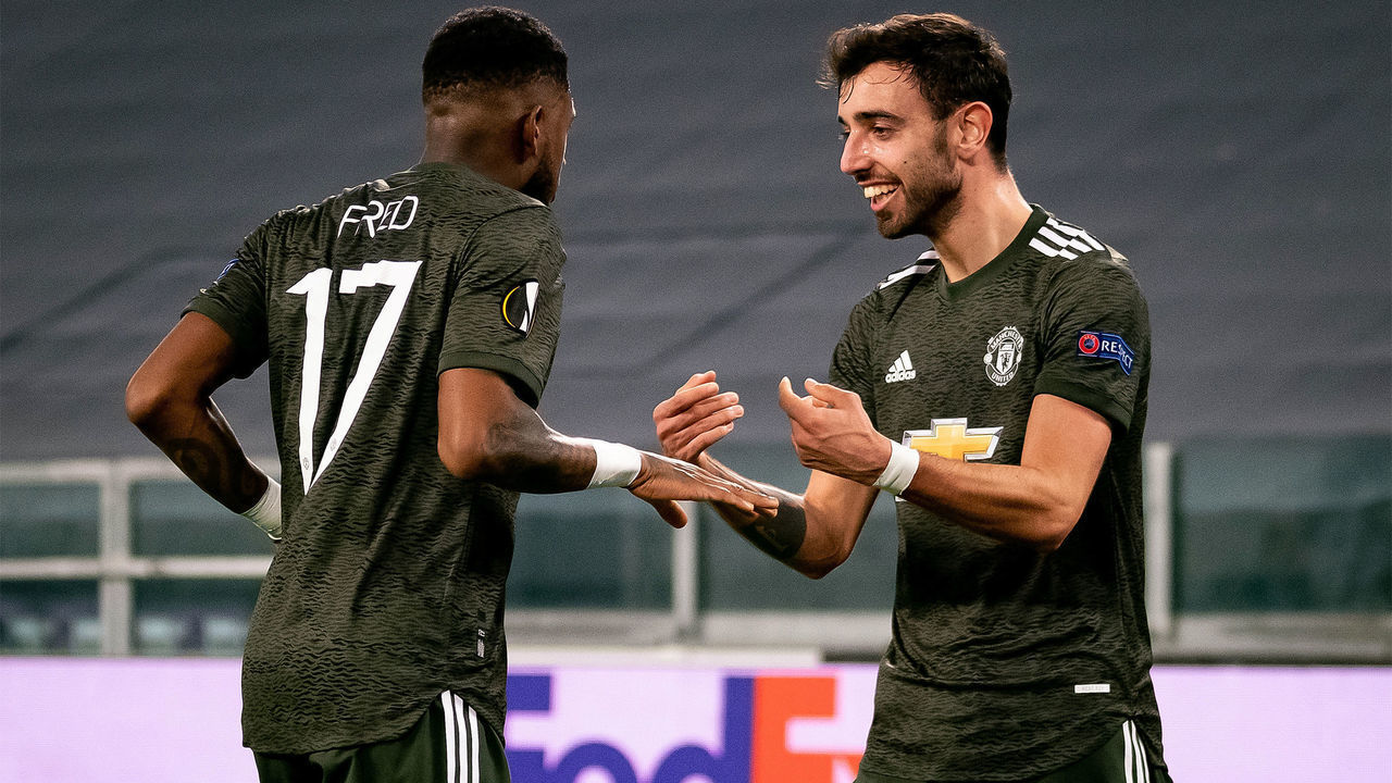 TURIN, ITALY - FEBRUARY 18: Bruno Fernandes of Manchester United celebrates scoring a goal to make the score 0-1 with Fred during the UEFA Europa League Round of 32 match between Real Sociedad and Manchester United at Allianz Stadium on February 18, 2021 in Turin, Italy.