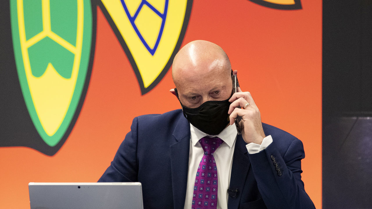 CHICAGO, ILLINOIS - OCTOBER 06: Vice president and general manager Stan Bowman of the Chicago Blackhawks works at the draft table during the first round of the 2020 NHL Entry Draft at Fifth Third Arena on October 06, 2020 in Chicago, Illinois. The 2020 NHL Draft was held virtually due to the ongoing Coronavirus pandemic.