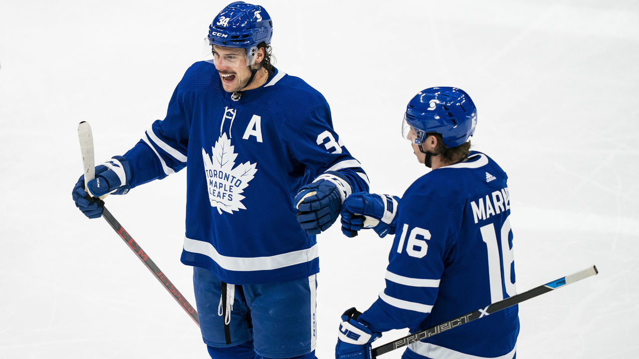 TORONTO, ON - FEBRUARY 18: Auston Matthews #34 of the Toronto Maple Leafs celebrates his goal against the Ottawa Senators with teammate Mitchell Marner #16 during the first period at the Scotiabank Arena on February 18, 2021 in Toronto, Ontario, Canada.