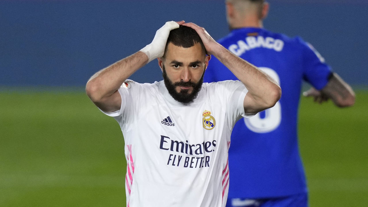 MADRID, SPAIN - FEBRUARY 09: Karim Benzema of Real Madrid reacts during the La Liga Santander match between Real Madrid and Getafe CF at Estadio Santiago Bernabeu on February 09, 2021 in Madrid, Spain. Sporting stadiums around Spain remain under strict restrictions due to the Coronavirus Pandemic as Government social distancing laws prohibit fans inside venues resulting in games being played behind closed doors.