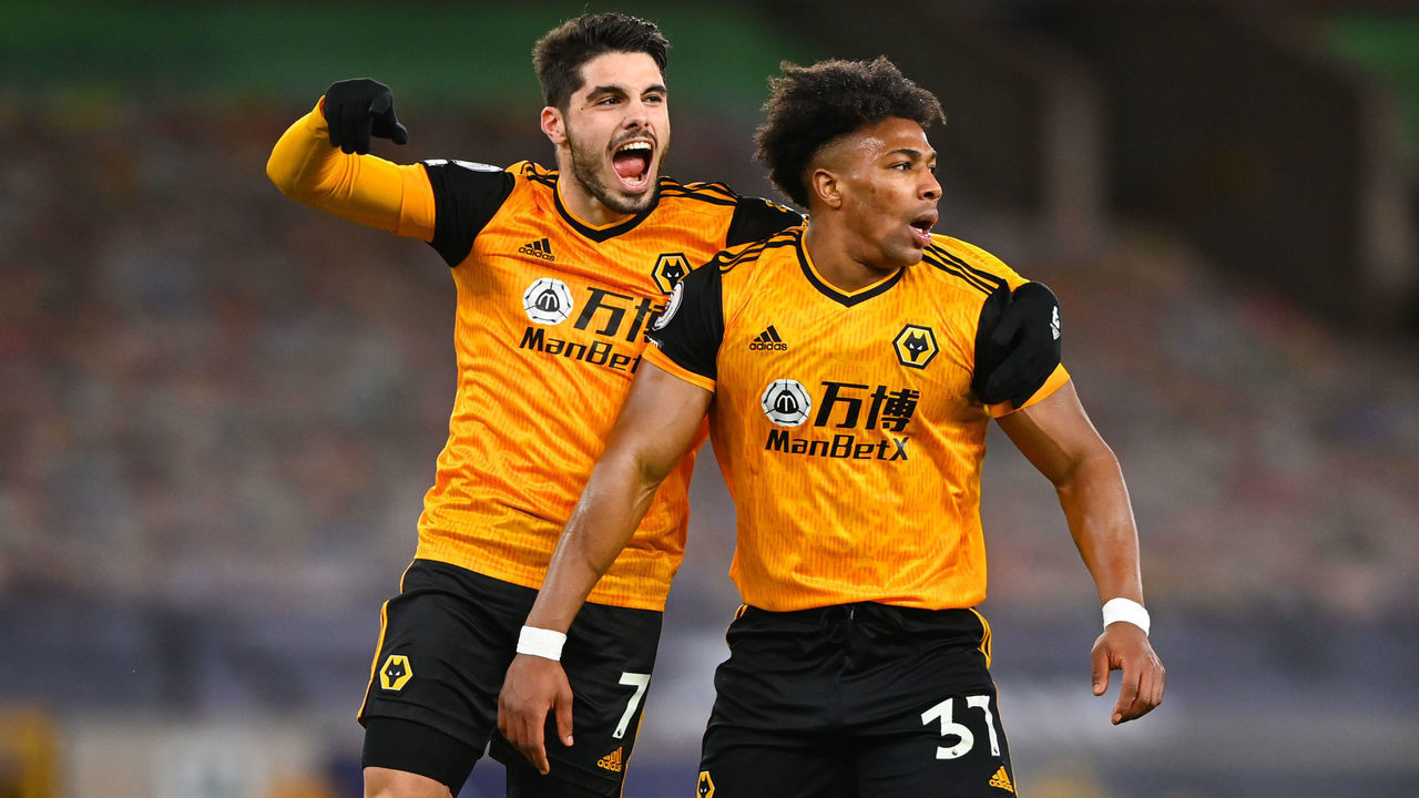 WOLVERHAMPTON, ENGLAND - FEBRUARY 19: Pedro Neto of Wolverhampton Wanderers celebrates after scoring a goal to make it 1-0 after an own goal by goalkeeper Illan Meslier of Leeds United following a shot at goal by Adama Traore during the Premier League match between Wolverhampton Wanderers and Leeds United at Molineux on February 19, 2021 in Wolverhampton, United Kingdom. Sporting stadiums around the UK remain under strict restrictions due to the Coronavirus Pandemic as Government social distancing laws prohibit fans inside venues resulting in games being played behind closed doors.