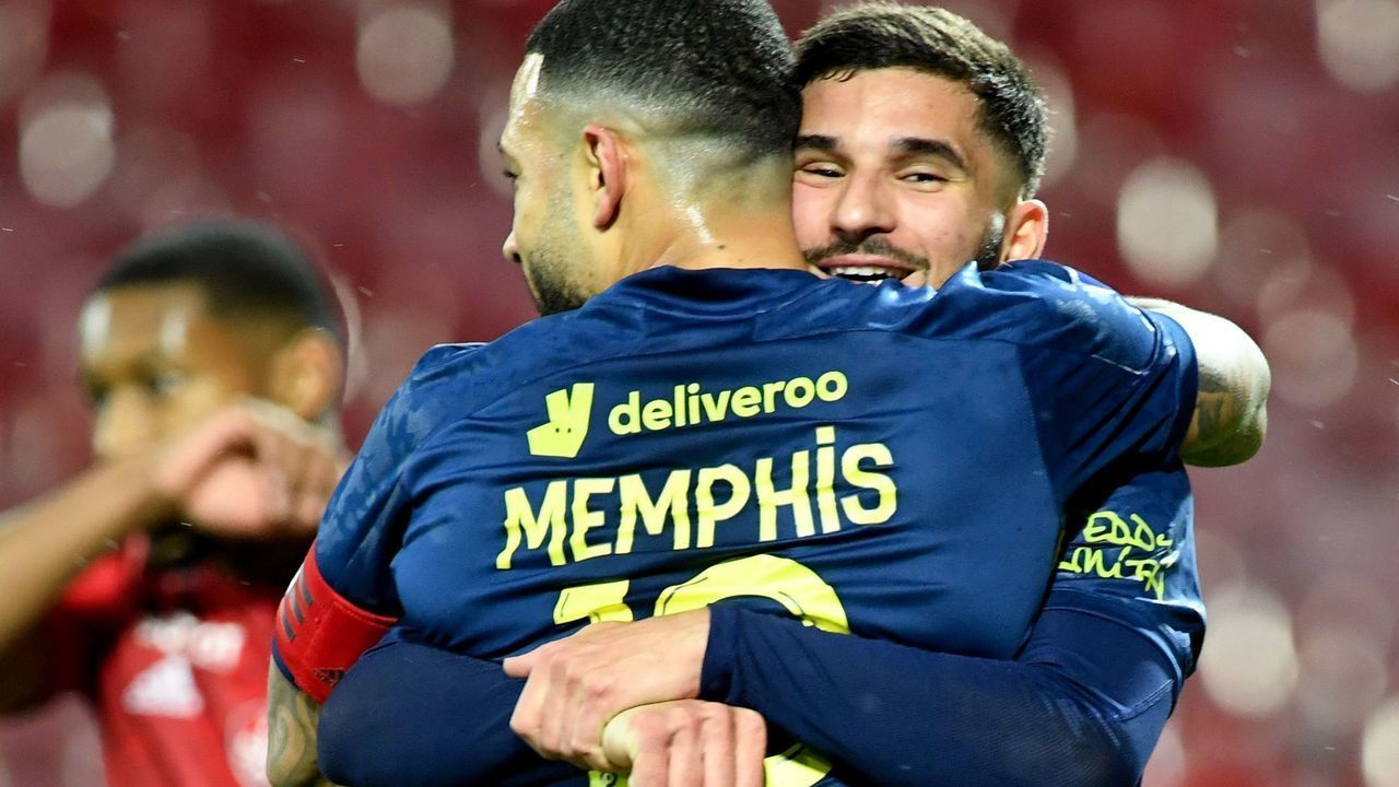 Lyon's French midfielder Houssem Aouar (R) celebrates with teammate Lyon's Dutch forward Memphis Depay after scoring a goal during the French L1 football match between Stade Brestois 29 (FC Brest) and Olympique Lyonnais - Lyon (OL) at The Francis Le Ble Stadium in Brest, western France on February 19, 2021.