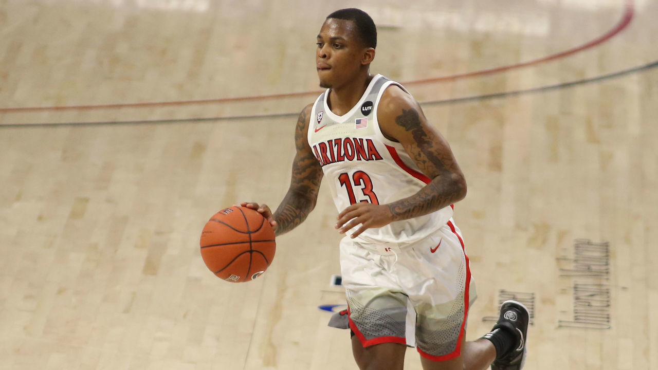 TUCSON, AZ - DECEMBER 07: Arizona Wildcats guard James Akinjo (13) dribbles the ball during a college basketball game between the Northern Arizona Lumberjacks and the Arizona Wildcats on December 07, 2020, at McKale Center in Tucson, AZ.