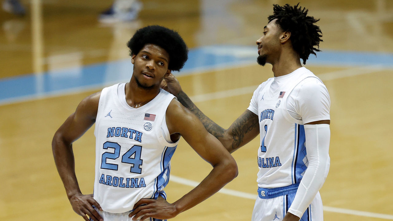 CHAPEL HILL, NORTH CAROLINA - FEBRUARY 17: Leaky Black # 1 teases Kerwin Walton #24 of the North Carolina Tar Heels about his haircut during the second half of their game against the Northeastern Huskies at the Dean Smith Center on February 17, 2021 in Chapel Hill, North Carolina. North Carolina won 82-62.