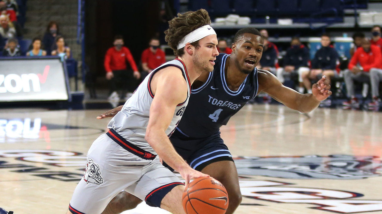 SPOKANE, WASHINGTON - FEBRUARY 20: Corey Kispert #24 of the Gonzaga Bulldogs drives against Josh Parrish #4 of the San Diego Toreros in the first half at McCarthey Athletic Center on February 20, 2021 in Spokane, Washington.