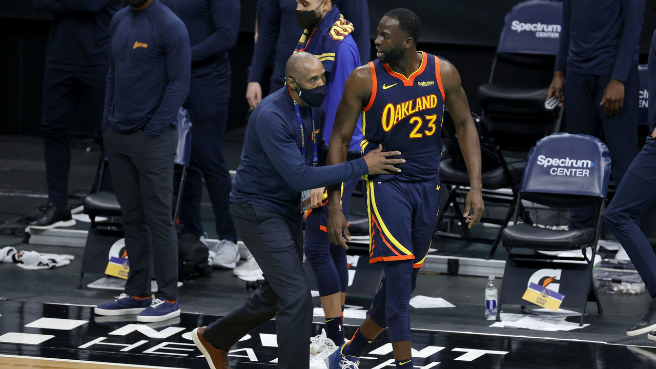 CHARLOTTE, NORTH CAROLINA - FEBRUARY 20: Draymond Green #23 of the Golden State Warriors is escorted off the court following his second technical foul during the fourth quarter of their game against the Charlotte Hornets at Spectrum Center on February 20, 2021 in Charlotte, North Carolina.