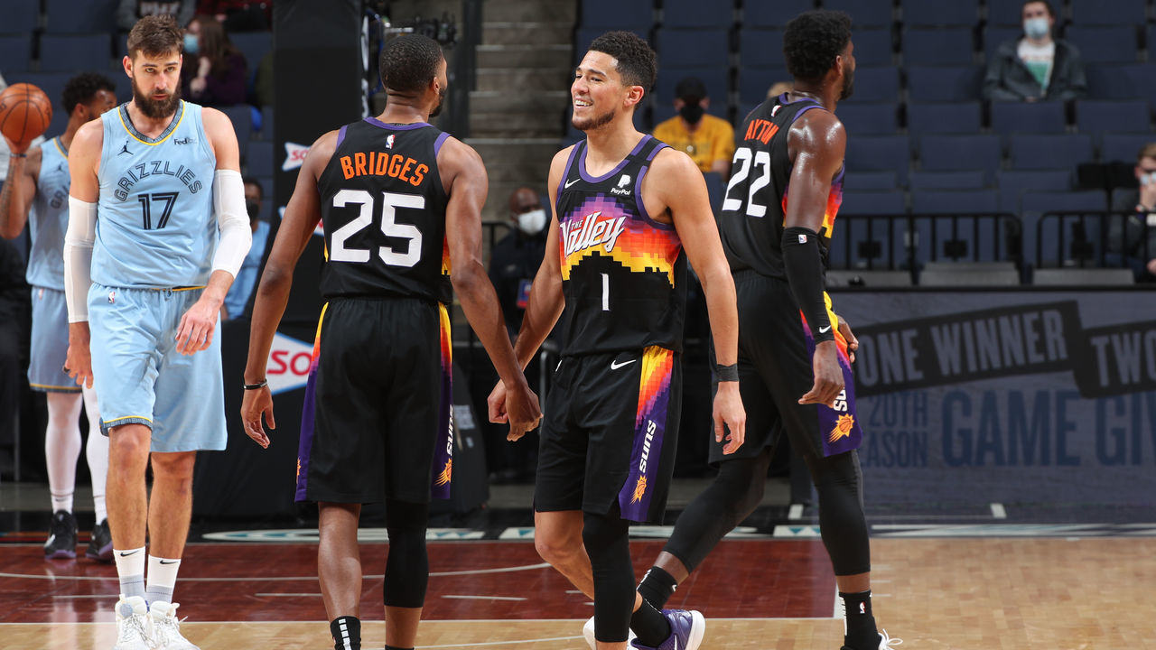 MEMPHIS, TN - FEBRUARY 20: Devin Booker #1 hi-fives Mikal Bridges #25 of the Phoenix Suns during the game against the Memphis Grizzlies on February 20, 2021 at FedExForum in Memphis, Tennessee. Mandatory Copyright Notice: Copyright 2021 NBAE