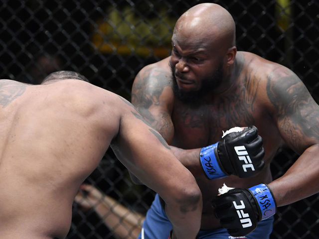 LAS VEGAS, NEVADA - FEBRUARY 20: (R-L) Derrick Lewis punches Curtis Blaydes in a heavyweight bout during the UFC Fight Night event at UFC APEX on February 20, 2021 in Las Vegas, Nevada.