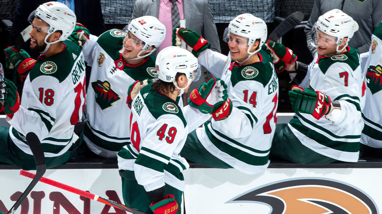 ANAHEIM, CA - FEBRUARY 20: Victor Rask #49 of the Minnesota Wild celebrates his third-period goal against the Anaheim Ducks with Jordan Greenway #18, Kevin Fiala #22, Joel Eriksson Ek #14 and Nico Sturm #7 on the bench at Honda Center on February 20, 2021 in Anaheim, California.