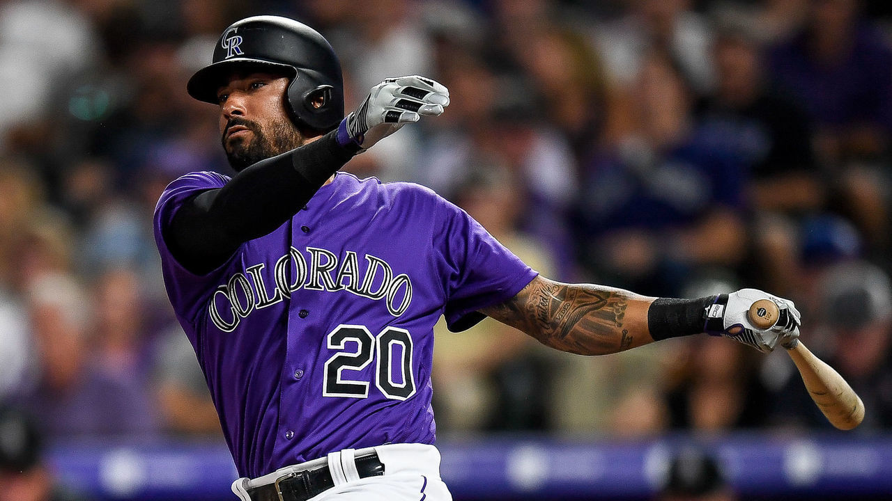 DENVER, CO - AUGUST 28: Colorado Rockies center fielder Ian Desmond (20) hits a fifth inning double against the Boston Red Sox during a regular season interleague Major League Baseball game on August 28, 2019 at Coors Field in Denver, Colorado.