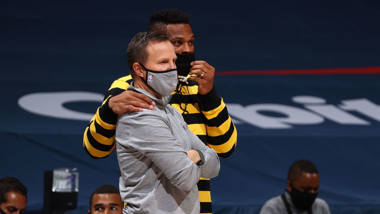 WASHINGTON, DC - DECEMBER 17: Washington Wizards head coach Scott Brooks stands court side with Russell Westbrook #4 during a preseason game against the Detroit Pistons on December 17 2020 at Capital One Arena in Washington, DC. Mandatory Copyright Notice: Copyright 2020 NBAE