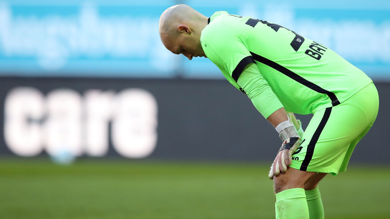 21 February 2021, Bavaria, Augsburg: Football: Bundesliga, FC Augsburg - Bayer Leverkusen, Matchday 22 at WWK Arena. Leverkusen goalkeeper Niklas Lomb looks down. IMPORTANT NOTE: In accordance with the regulations of the DFL Deutsche Fußball Liga and the DFB Deutscher Fußball-Bund, it is prohibited to use or have used photographs taken in the stadium and/or of the match in the form of sequence pictures and/or video-like photo series. Photo: Tom Weller/dpa