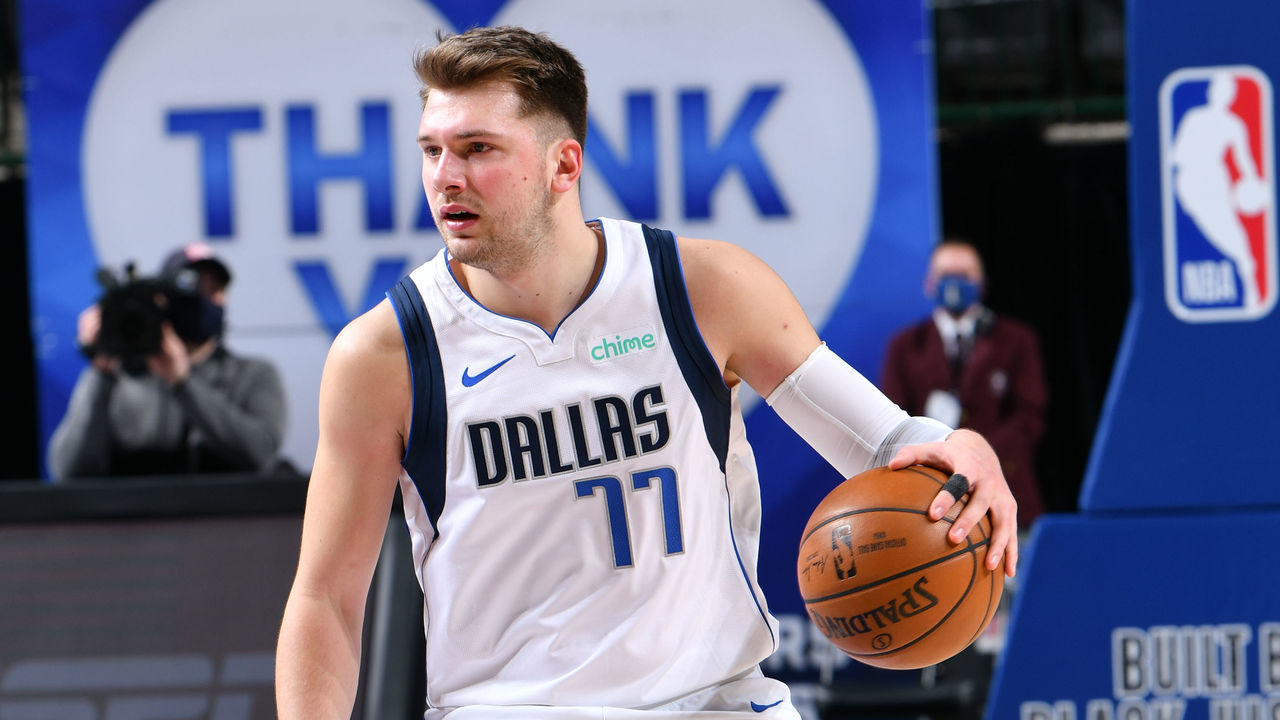 DALLAS, TX - FEBRUARY 14: Luka Doncic #77 of the Dallas Mavericks dribbles the ball during the game against the Portland Trail Blazers on February 14, 2021 at the American Airlines Center in Dallas, Texas. Mandatory Copyright Notice: Copyright 2021 NBAE