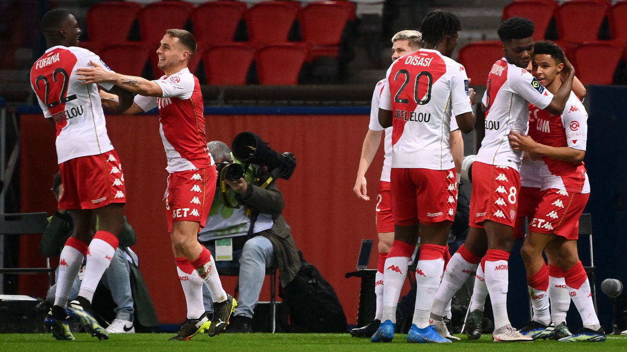 Monaco's French midfielder Sofiane Diop (R) is congratulated by teammates after scoring a goal during the French L1 football match between Paris-Saint Germain (PSG) and AS Monaco FC at The Parc des Princes Stadium in Paris on February 21, 2021.