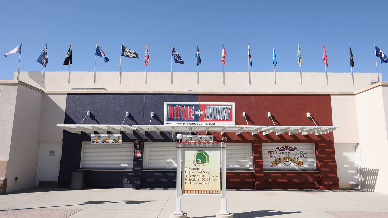 SURPRISE, ARIZONA - APRIL 07: 15 MLB Cactus League team flags are flown inside of the Texas Rangers and Kansas City Royals spring training facility, Surprise Stadium on April 07, 2020 in Surprise, Arizona. According to reports, Major League Baseball is considering a scenario in which all 30 of its teams play an abbreviated regular season without fans in Arizona's various baseball facilities, including Chase Field and 10 spring training venues.