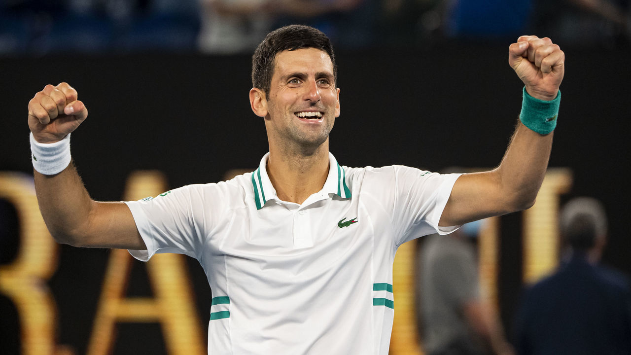 MELBOURNE, AUSTRALIA - FEBRUARY 21: Novak Djokovic of Serbia celebrates after beating Daniil Medvedev of Russia in the men's singles final during day 14 of the 2021 Australian Open at Melbourne Park on February 21, 2021 in Melbourne, Australia.