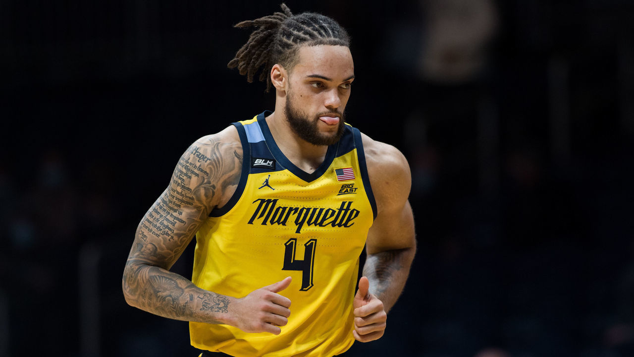 INDIANAPOLIS, IN - FEBRUARY 17: Marquette Golden Eagles forward Theo John (4) checks back into the game during the men's college basketball game between the Marquette Golden Eagles and Butler Bulldogs on February 17, 2021, at Hinkle Fieldhouse in Indianapolis, IN.