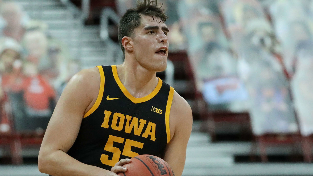 MADISON, WISCONSIN - FEBRUARY 18: Luka Garza #55 of the Iowa Hawkeyes handles the ball in the first half against the Wisconsin Badgers at the Kohl Center on February 18, 2021 in Madison, Wisconsin.