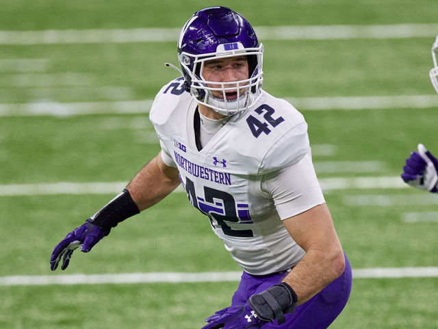 INDIANAPOLIS, IN - DECEMBER 19: Northwestern Wildcats linebacker Paddy Fisher (42) runs in action during the Big Ten Championship game between the Ohio State Buckeyes and the Northwestern Wildcats on December 19, 2020 at Lucas Oil stadium, in Indianapolis, IN.