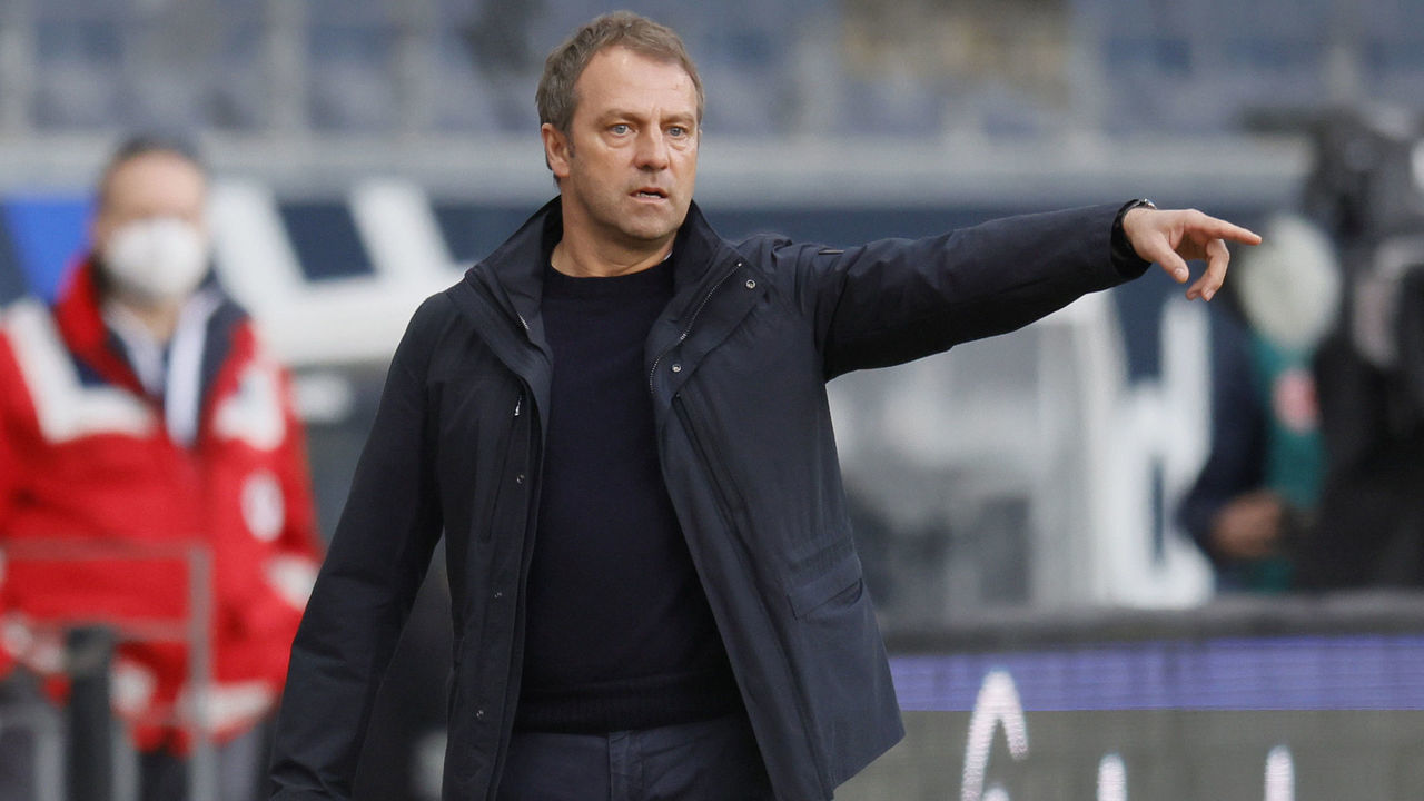 FRANKFURT AM MAIN, GERMANY - FEBRUARY 20: Hans-Dieter Flick, Manager of FC Bayern Muenchen gives his team instructions during the Bundesliga match between Eintracht Frankfurt and FC Bayern Muenchen at Deutsche Bank Park on February 20, 2021 in Frankfurt am Main, Germany. Sporting stadiums around Germany remain under strict restrictions due to the Coronavirus Pandemic as Government social distancing laws prohibit fans inside venues resulting in games being played behind closed doors.