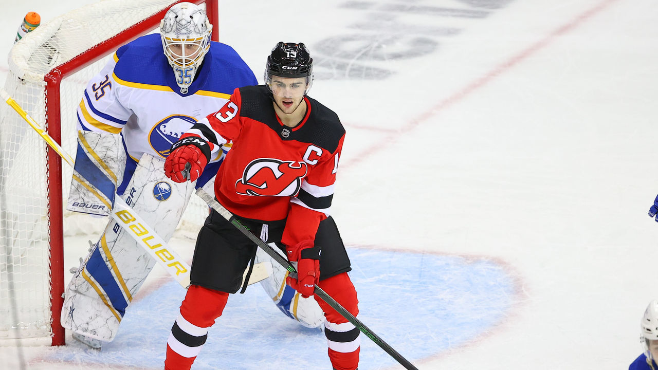 NEWARK, NJ - FEBRUARY 20: New Jersey Devils center Nico Hischier (13) sets upin front of Buffalo Sabres goaltender Linus Ullmark (35) during the National Hockey League game between the New Jersey Devils and the Buffalo Sabres on February 20, 2021 at the Prudential Center in Newark, NJ.