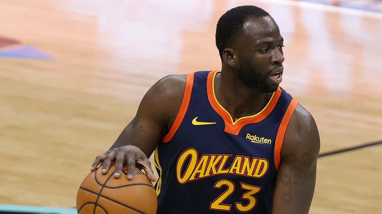 CHARLOTTE, NORTH CAROLINA - FEBRUARY 20: Draymond Green #23 of the Golden State Warriors dribbles during the second quarter of their game against the Charlotte Hornets at Spectrum Center on February 20, 2021 in Charlotte, North Carolina.