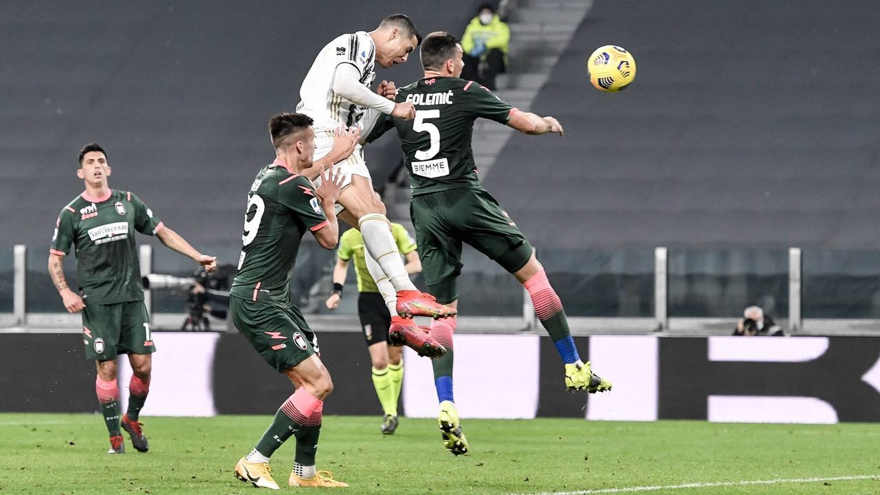 TURIN, ITALY - FEBRUARY 22: Cristiano Ronaldo of Juventus scores his team's second goal during the Serie A match between Juventus and FC Crotone at Allianz Stadium on February 22, 2021 in Turin, Italy. Sporting stadiums around Italy remain under strict restrictions due to the Coronavirus Pandemic as Government social distancing laws prohibit fans inside venues resulting in games being played behind closed doors.