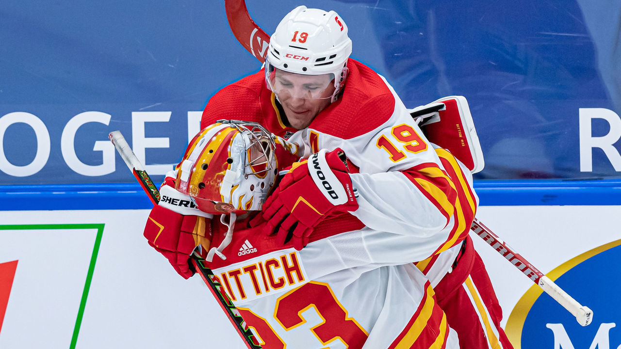 TORONTO, ON - FEBRUARY 22: Calgary Flames Goalie David Rittich (33) celebrates his shutout with Calgary Flames Left Wing Matthew Tkachuk (19) after the NHL regular season game between the Calgary Flames and the Toronto Maple Leafs on February 22, 2021, at Scotiabank Arena in Toronto, ON, Canada.