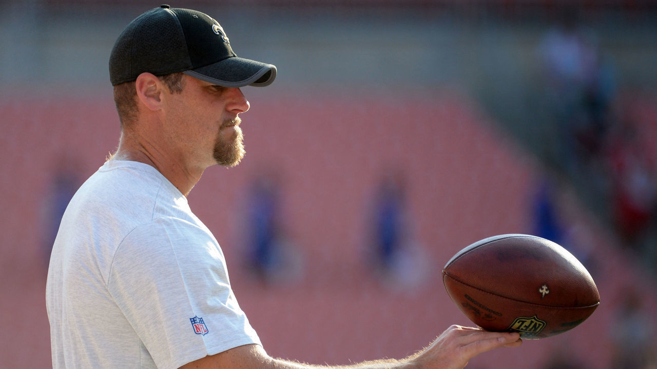 CLEVELAND, OH - AUGUST 10, 2017: Assistant head coach/tight ends Dan Campbell of the New Orleans Saints plays with a football as he stands on the sideline prior to a preseason game on August 10, 2017 against the Cleveland Browns at FirstEnergy Stadium in Cleveland, Ohio. Cleveland won 20-14. (Photo by: 2017 Nick Cammett/Diamond Images/Getty Images)