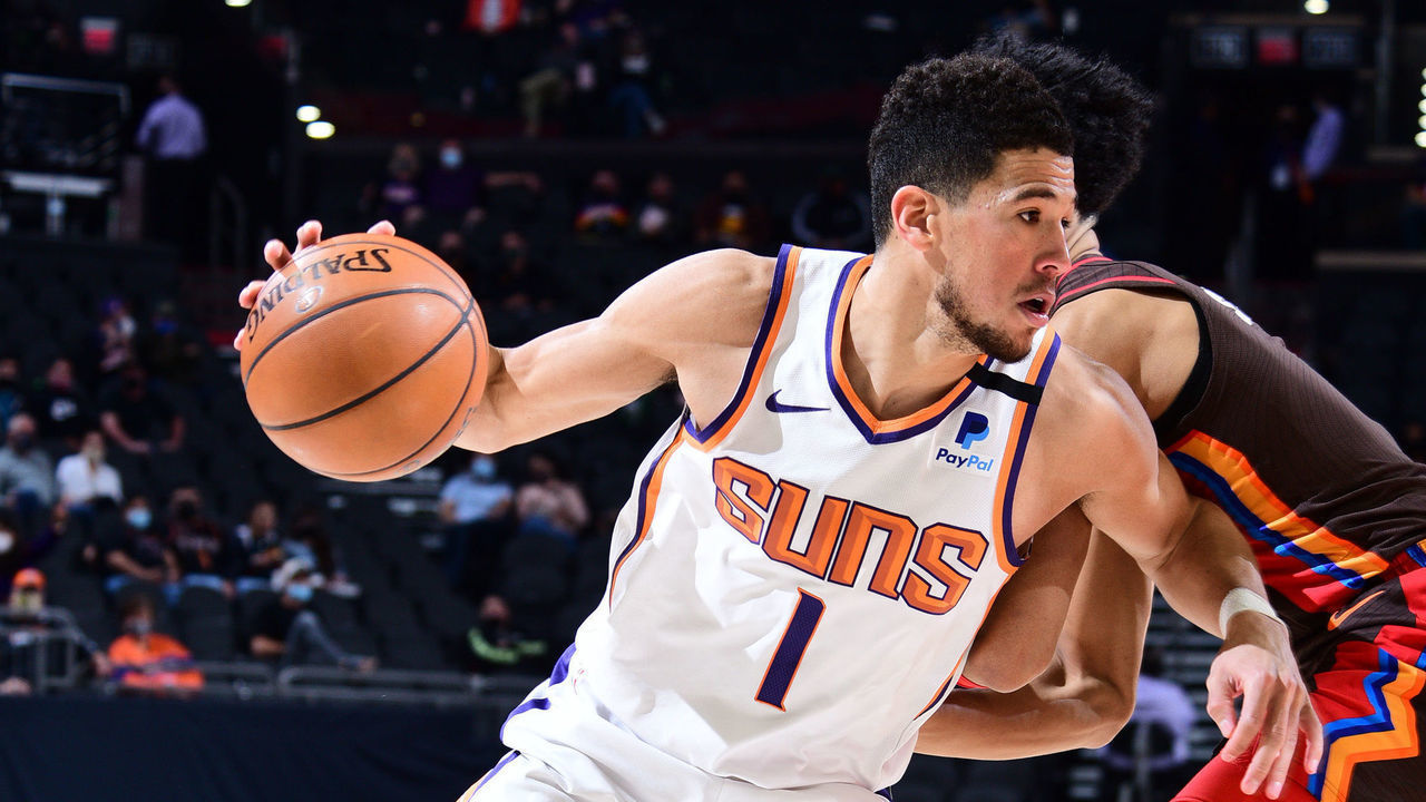 PHOENIX, AZ - FEBRUARY 22: Devin Booker #1 of the Phoenix Suns drives to the basket during the game against the Portland Trail Blazers on February 22, 2021 at Talking Stick Resort Arena in Phoenix, Arizona. Mandatory Copyright Notice: Copyright 2021 NBAE