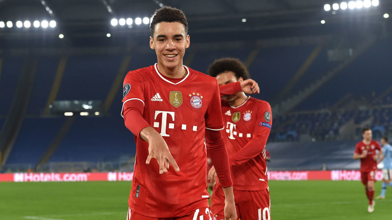 ROME, ITALY - FEBRUARY 23: Jamal Musiala of FC Bayern Muenchen celebrates after scoring their side's second goal during the UEFA Champions League Round of 16 match between Lazio Roma and Bayern München at Olimpico Stadium on February 23, 2021 in Rome, Italy. Sporting stadiums around Italy remain under strict restrictions due to the Coronavirus Pandemic as Government social distancing laws prohibit fans inside venues resulting in games being played behind closed doors.