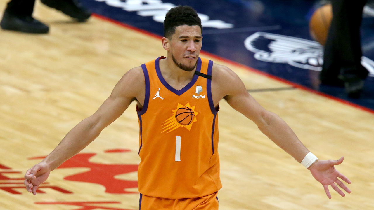 NEW ORLEANS, LOUISIANA - FEBRUARY 19: Devin Booker #1 of the Phoenix Suns reacts to a call during the first half of a NBA game against the New Orleans Pelicans at Smoothie King Center on February 19, 2021 in New Orleans, Louisiana.