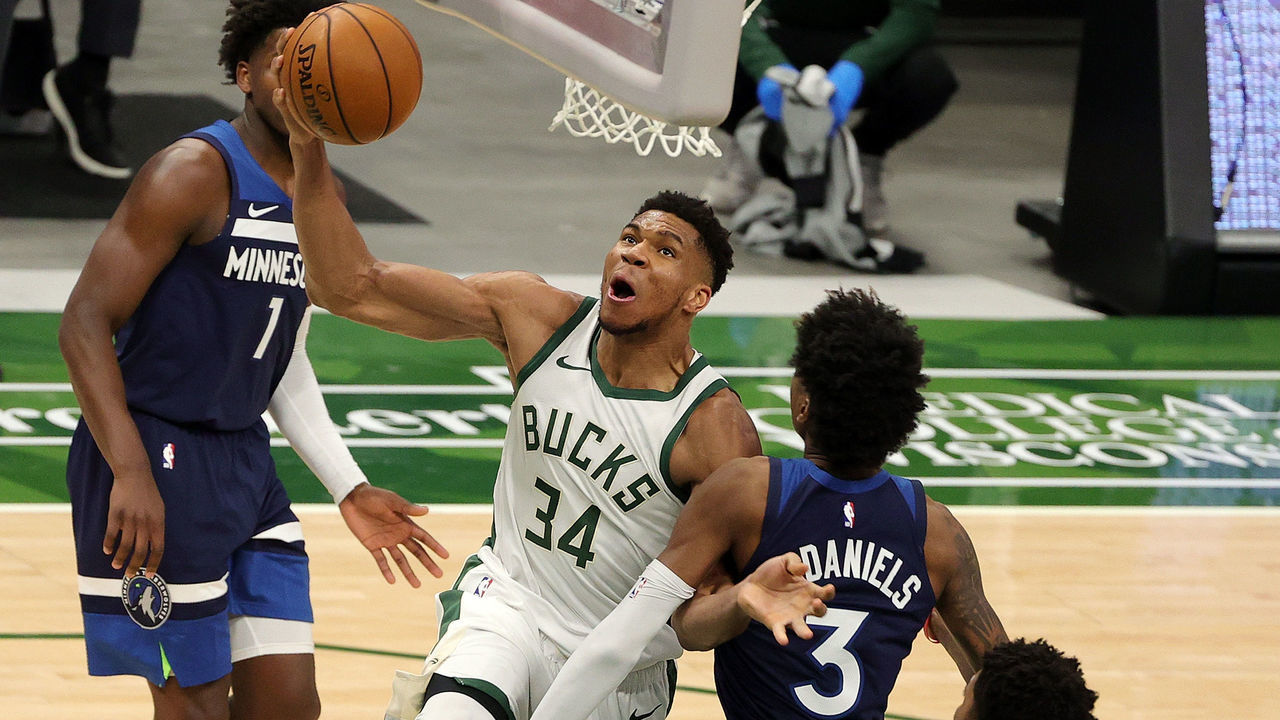 MILWAUKEE, WISCONSIN - FEBRUARY 23: Giannis Antetokounmpo #34 of the Milwaukee Bucks drives to the basket against Jaden McDaniels #3 of the Minnesota Timberwolves during the second half of a game at Fiserv Forum on February 23, 2021 in Milwaukee, Wisconsin.