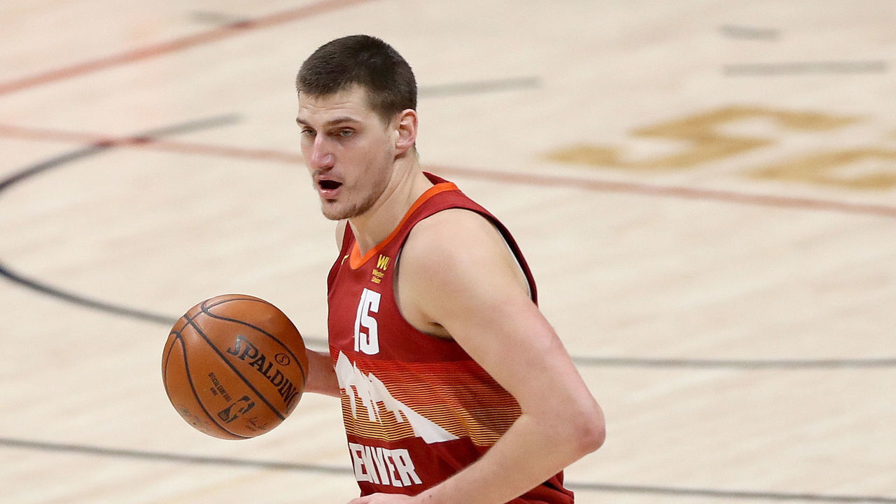 DENVER, COLORADO - FEBRUARY 23: Nikola Jokic #15 of the Denver Nuggets brings the ball down the court against the Portland Trailblazers in the second quarter at Ball Arena on February 23, 2021 in Denver, Colorado.