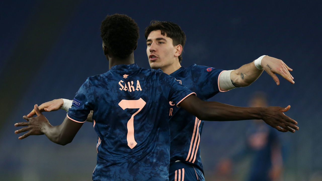 ROME, ITALY - FEBRUARY 18: Bukayo Saka of Arsenal celebrates after scoring their sides first goal with team mate Hector Bellerin during the UEFA Europa League Round of 32 match between SL Benfica and Arsenal FC at Stadio Olimpico on February 18, 2021 in Rome, Italy. SL Benfica face Arsenal FC at a neutral venue in Rome behind closed doors after Portugal imposed a ban on travellers arriving from the UK in an effort to prevent the spread of Covid-19 variants.