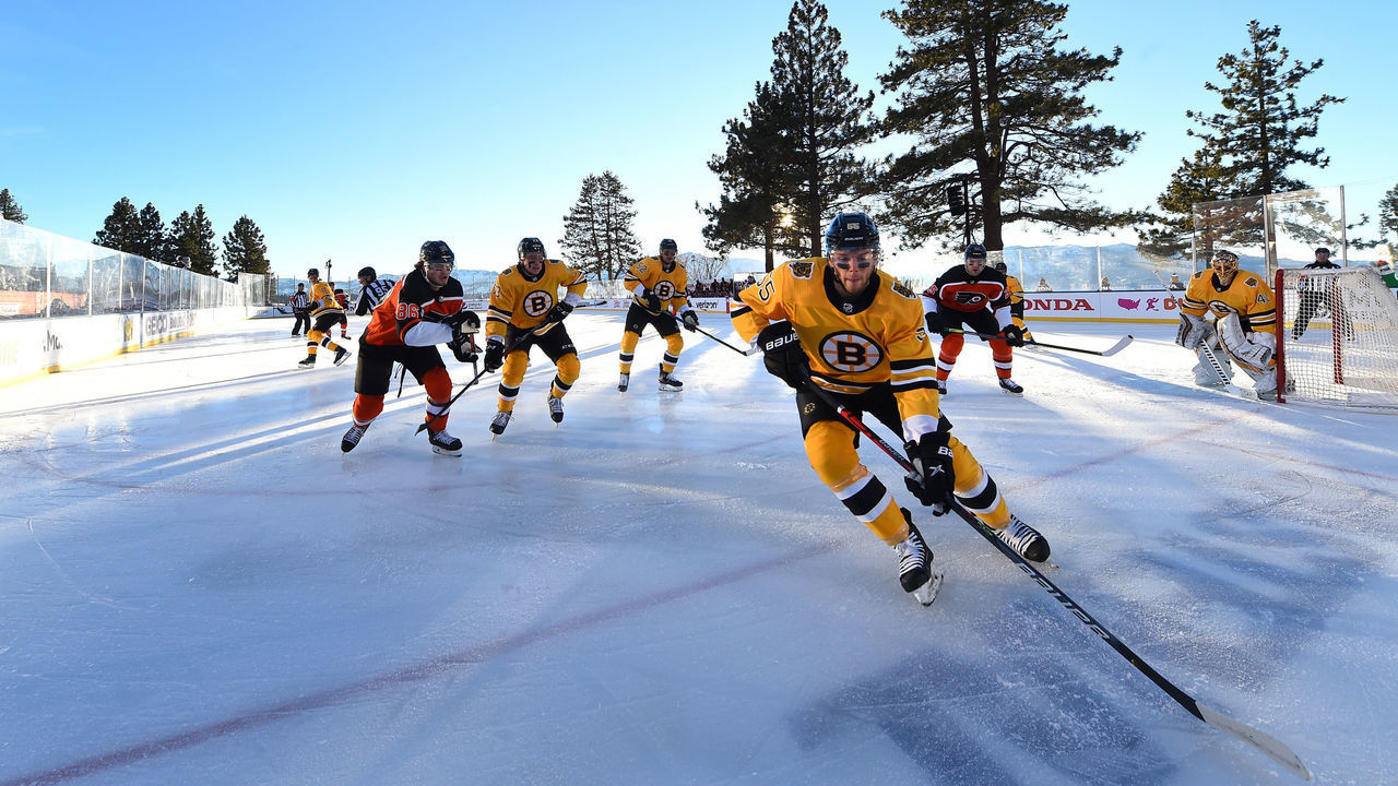 STATELINE, NEVADA - FEBRUARY 21: Jeremy Lauzon #55 of the Boston Bruins controls the puck against the Philadelphia Flyers during the first period of the 2021 NHL Outdoors Sunday presented by Honda on the 18th fairway of the Edgewood Tahoe Resort, at the south shore of Lake Tahoe on February 21, 2021 in Stateline, Nevada.