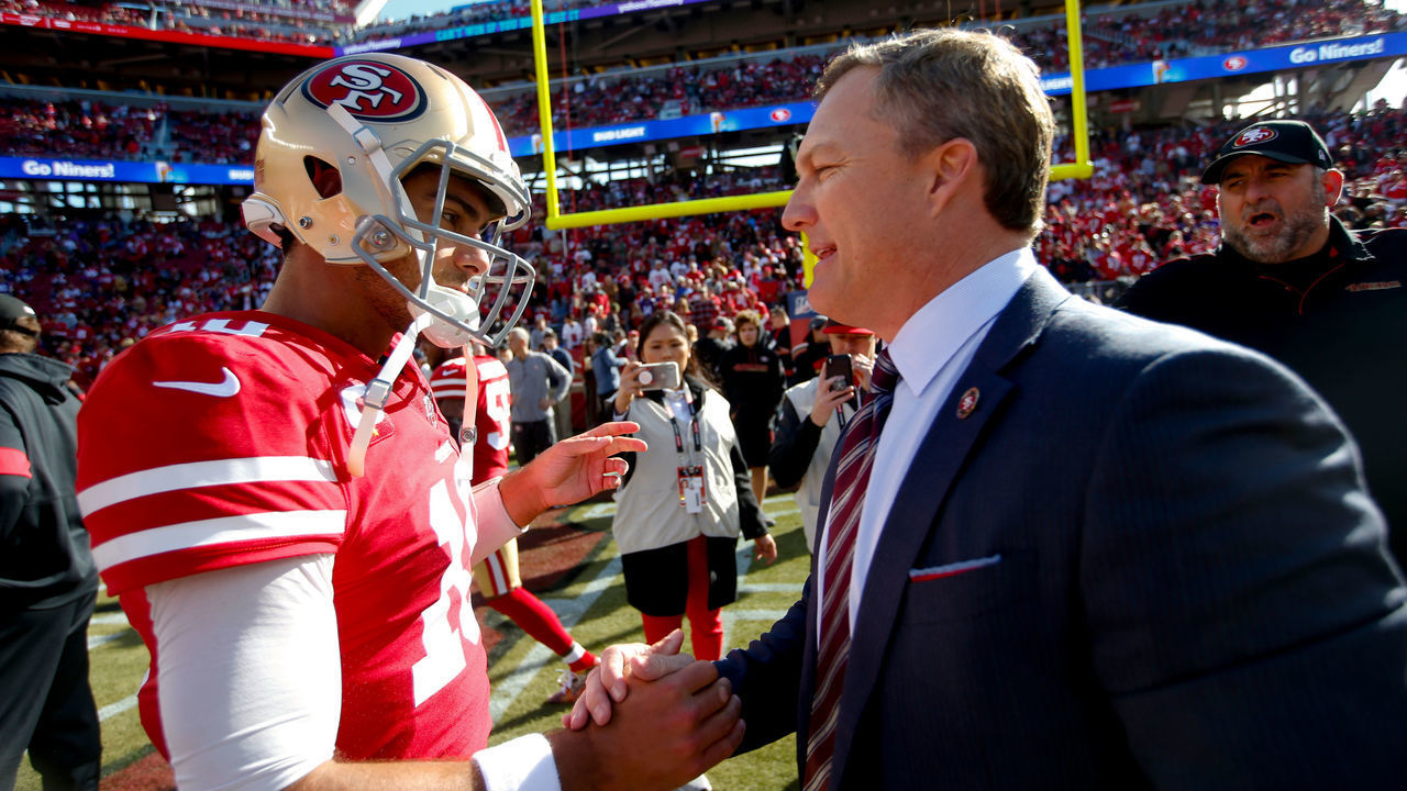 SANTA CLARA, CA - JANUARY 11: Jimmy Garoppolo #10 and General Manager John Lynch of the San Francisco 49ers talk on the field prior to the game against the Minnesota Vikings at Levi's Stadium on January 11, 2020 in Santa Clara, California. The 49ers defeated the Vikings 27-10.
