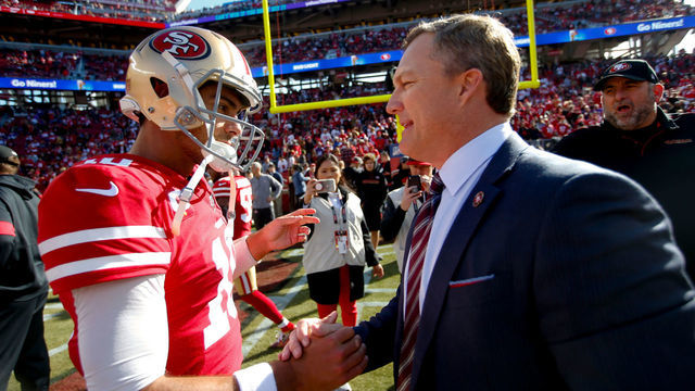 SANTA CLARA, CA - JANUARY 11: Jimmy Garoppolo #10 and General Manager John Lynch of the San Francisco 49ers talk on the field prior to the game against the Minnesota Vikings at Levi's Stadium on January 11, 2020 in Santa Clara, California. The 49ers defeated the Vikings 27-10.
