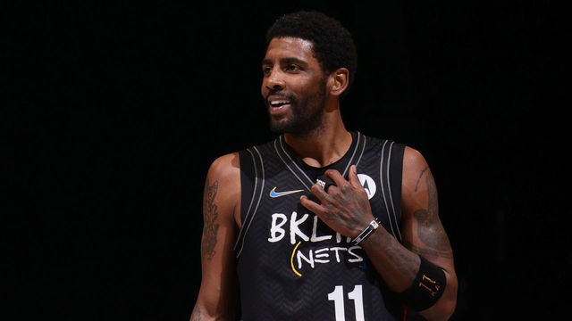 BROOKLYN, NY - FEBRUARY 23: Kyrie Irving #11 of the Brooklyn Nets smiles during the game against the Sacramento Kings on February 23, 2021 at Barclays Center in Brooklyn, New York. Mandatory Copyright Notice: Copyright 2021 NBAE