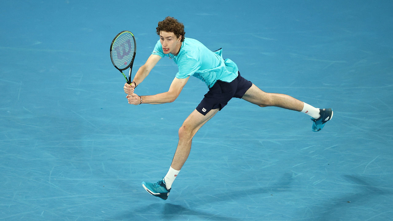 MELBOURNE, AUSTRALIA - FEBRUARY 10: Ugo Humbert of France plays a backhand in his Men's Singles second round match against Nick Kyrgios of Australia during day three of the 2021 Australian Open at Melbourne Park on February 10, 2021 in Melbourne, Australia.