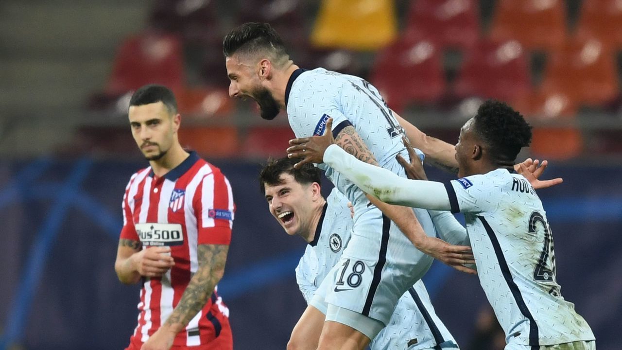 TOPSHOT - Chelsea's French striker Olivier Giroud (C) celebrates after scoring during the UEFA Champions League round of 16 first leg football match between Club Atletico de Madrid and Chelsea at the Arena Nationala stadium in Bucharest on February 23, 2021.