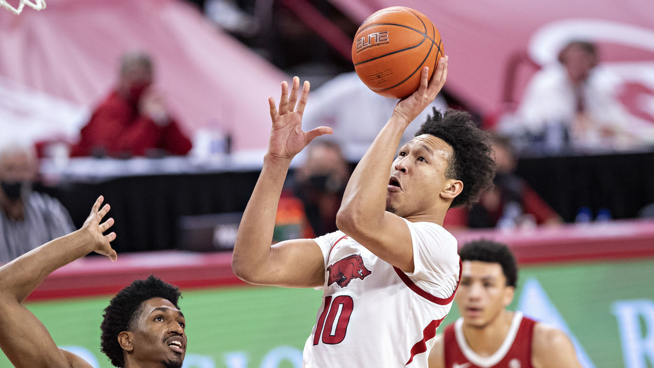 FAYETTEVILLE, ARKANSAS - FEBRUARY 24: Jaylin Williams #10 of the Arkansas Razorbacks goes up for a shot in the first half against the Alabama Crimson Tide at Bud Walton Arena on February 24, 2021 in Fayetteville, Arkansas.