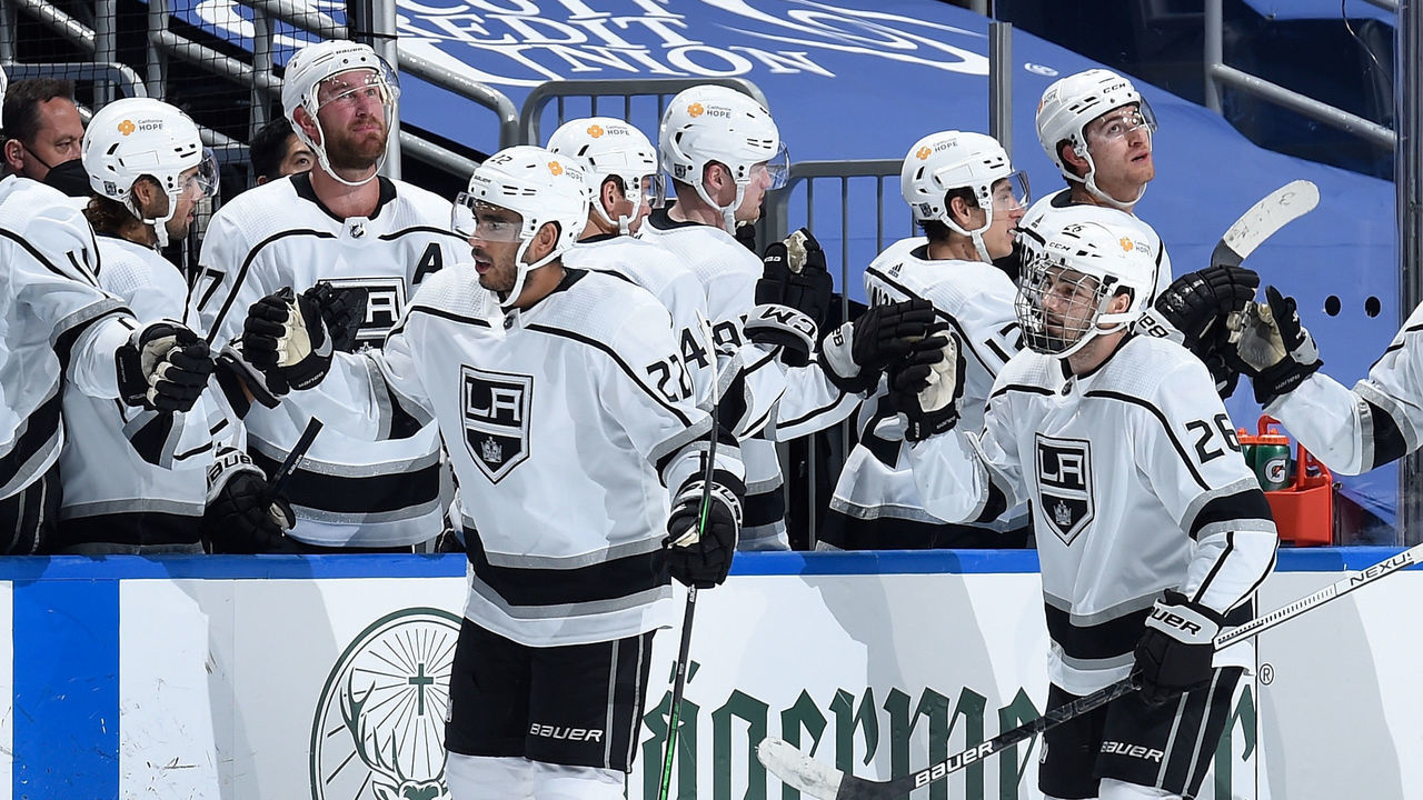 ST. LOUIS, MO - FEBRUARY 24: Andreas Athanasiou #22 of the Los Angeles Kings is congratulated by teammates after scoring a goal against the St. Louis Blues on February 24, 2021 at the Enterprise Center in St. Louis, Missouri.