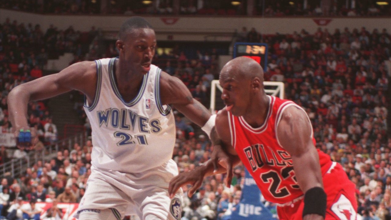 The Wolves'Kevin Garnett, #21, against the driving Michael Jorden, #23. Garnett managed to keep Jorden from a shot on this play, but got a couple of lessons later in the game.