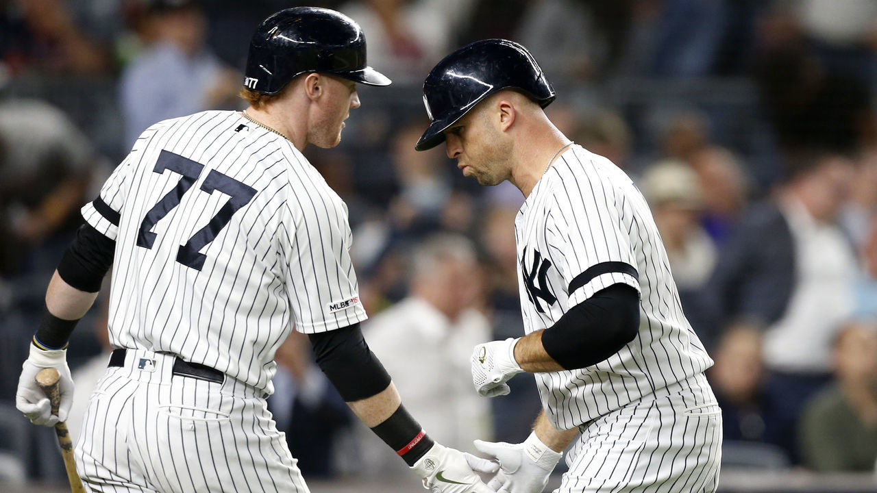NEW YORK, NEW YORK - SEPTEMBER 19: (NEW YORK DAILIES OUT) Brett Gardner #11 and Clint Frazier #77 of the New York Yankees in action against the Los Angeles Angels of Anaheim at Yankee Stadium on September 19, 2019 in New York City. The Yankees defeated the Angels 9-1 to clinch the American League East division.