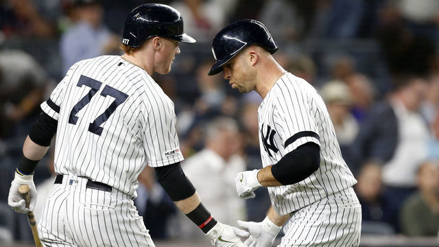 NEW YORK, NEW YORK - SEPTEMBER 19: (NEW YORK DAILIES OUT) Brett Gardner #11 and Clint Frazier #77 of the New York Yankees in action against the Los Angeles Angels of Anaheim at Yankee Stadium on September 19, 2019 in New York City. The Yankees defeated the Angels 9-1 to clinch the American League East division.