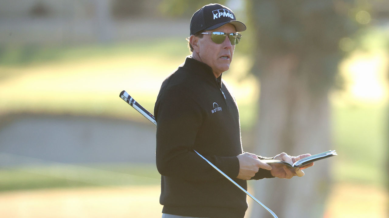 TUCSON, ARIZONA - FEBRUARY 25: Phil Mickelson looks at his scorecard on the 14th green during the Pro-Am before the Cologuard Classic at the Catalina Course of the Omni Tucson National Resort on February 25, 2021 in Tucson, Arizona.