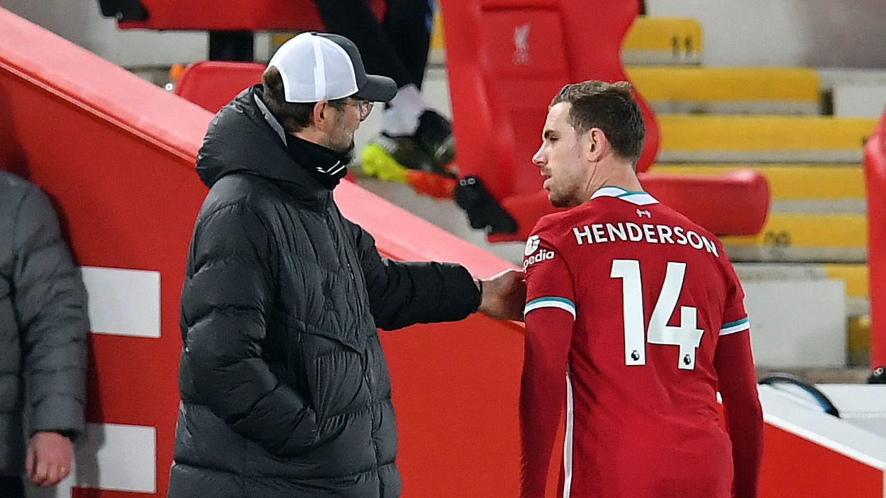 Liverpool's Jordan Henderson with manager Jurgen Klopp after being substituted with an injury during the Premier League match at Anfield, Liverpool. Picture date: Saturday February 20, 2021.